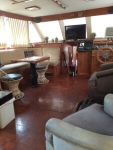 Boat cabin interior with seating and helm